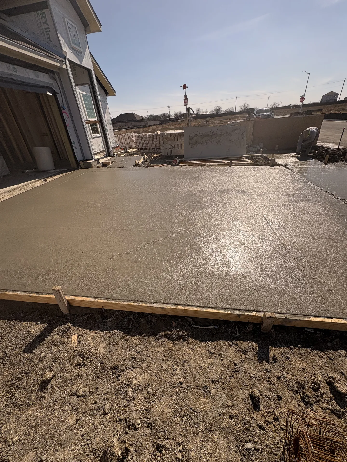 Side view of the newly poured Creedmoor driveway