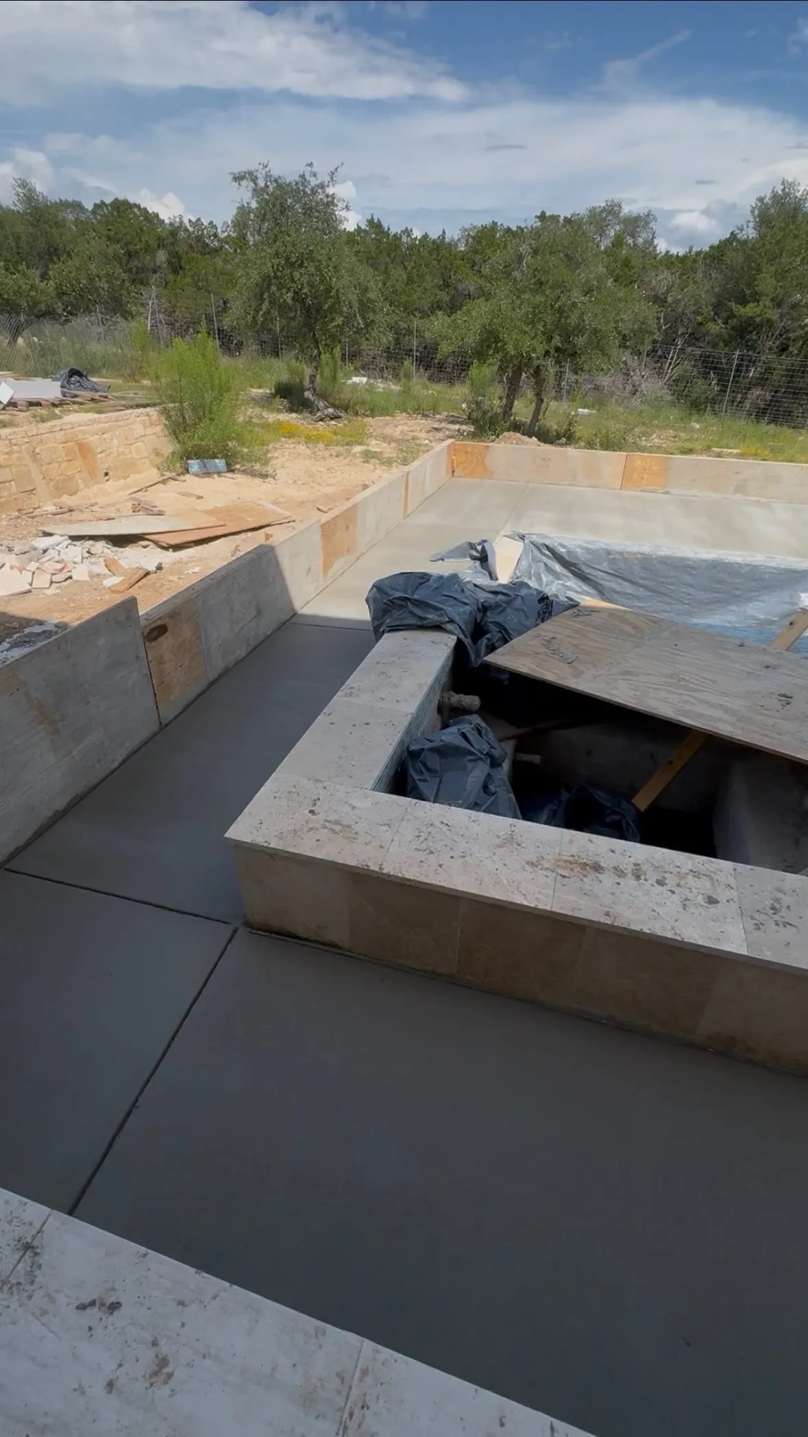 Poolside concrete patio with integrated stairs
