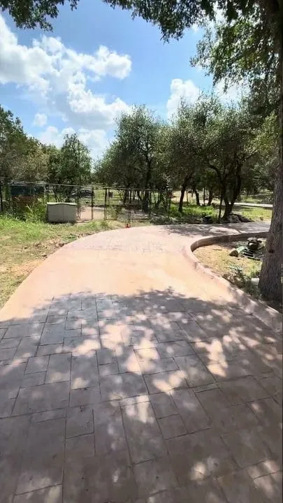 Colored concrete section being poured on the San Marcos driveway