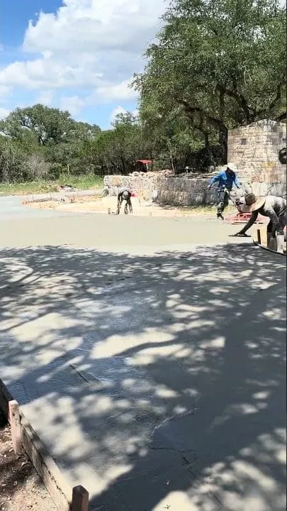 Hand finishing the concrete surface at the San Marcos jobsite