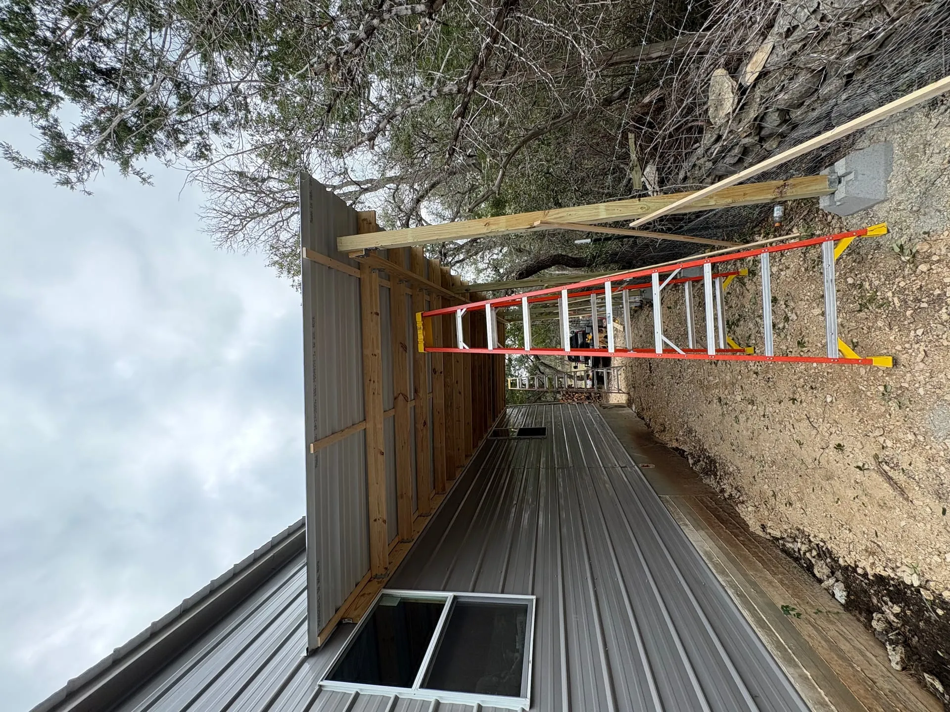 Before photo of side porch area prepared for under-porch storage enclosure in San Marcos, TX