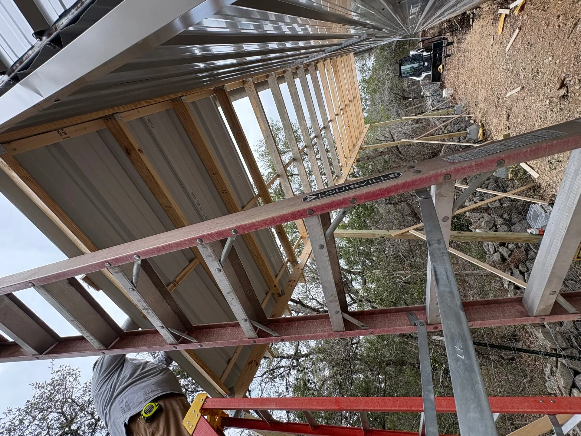 Near-complete side porch under-storage enclosure with finished access and clean lines