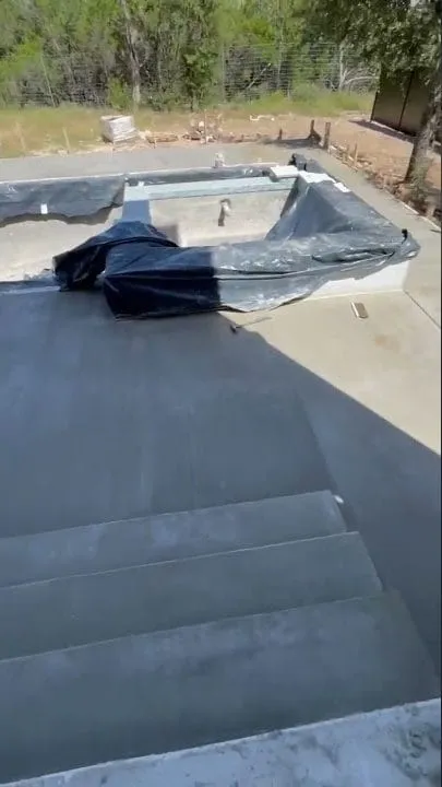 Finished concrete pool deck and patio in West Lake, angle one